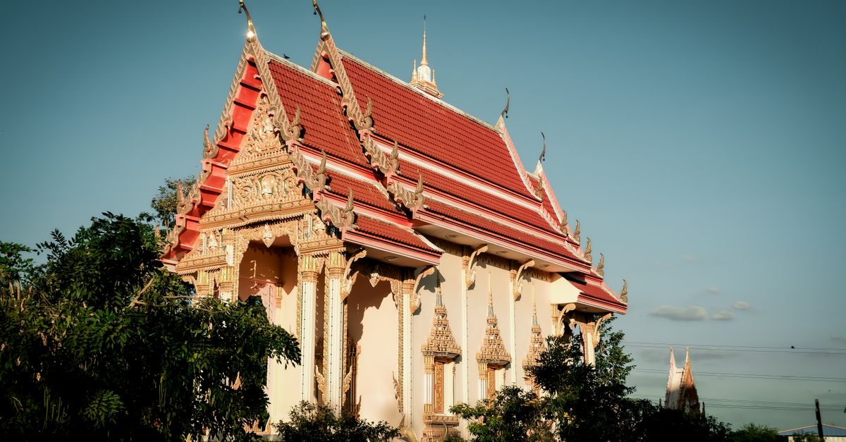 Wat Chalong temple under a clear blue Phuket sky.