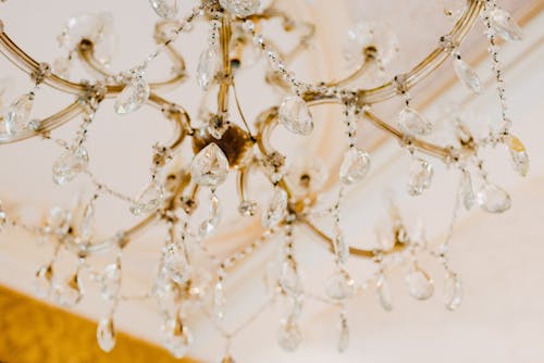 Gold Crystal Chandelier Hanging from Ceili