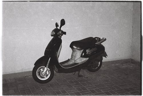 Black and White Photo of a Motor Scooter 