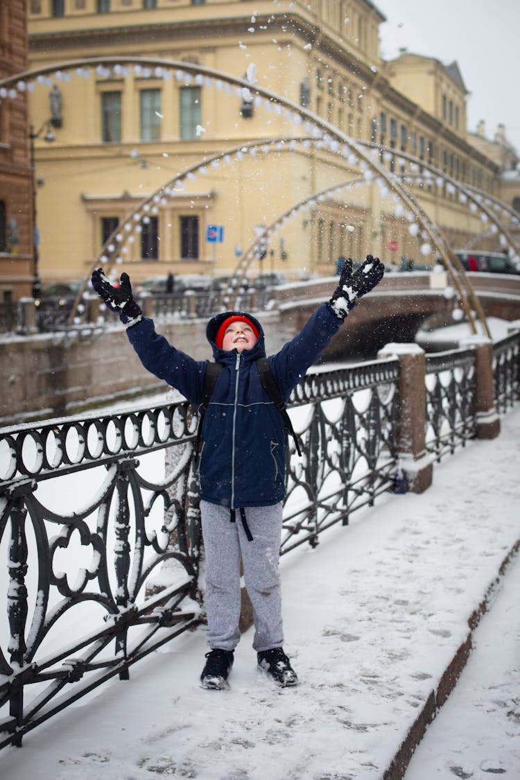 Little Boy On A Bridge In Winter 