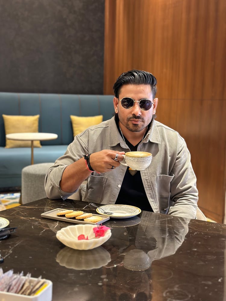 Man In Sunglasses Drinking Cappuccino