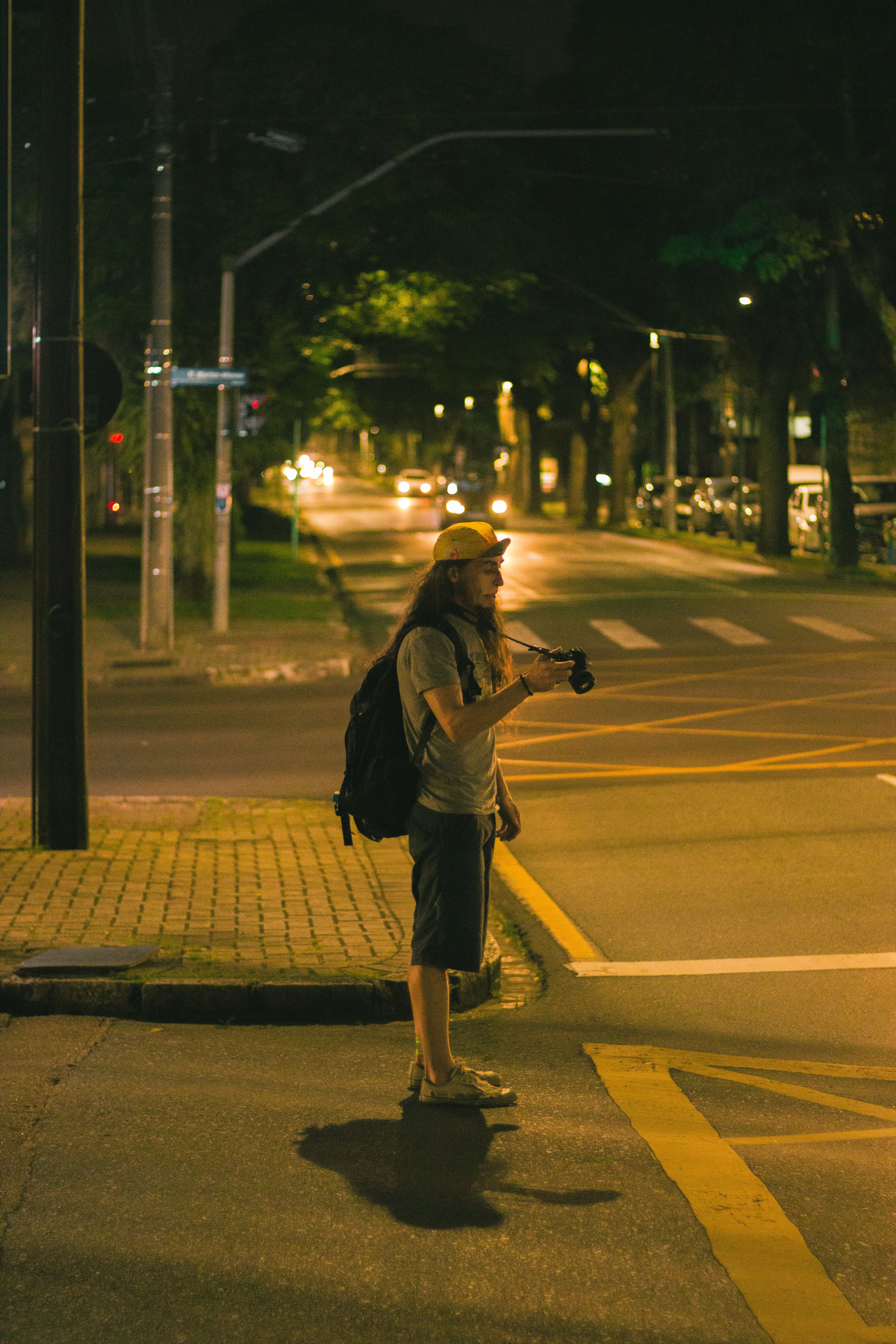 Man Standing on a Street at Dusk · Free Stock Photo