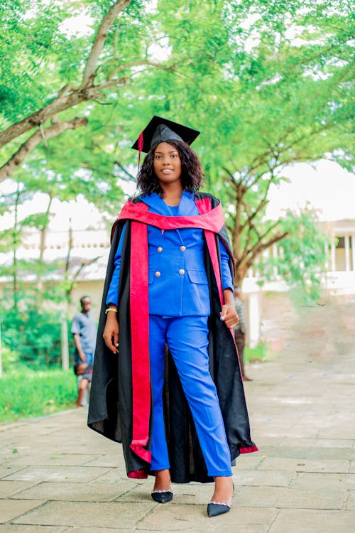 Woman in a Graduation Gown and Cap