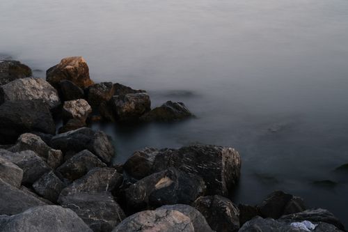 Free Tranquil morning scene of rocks by the İstanbul seashore, enveloped in gentle fog. Stock Photo