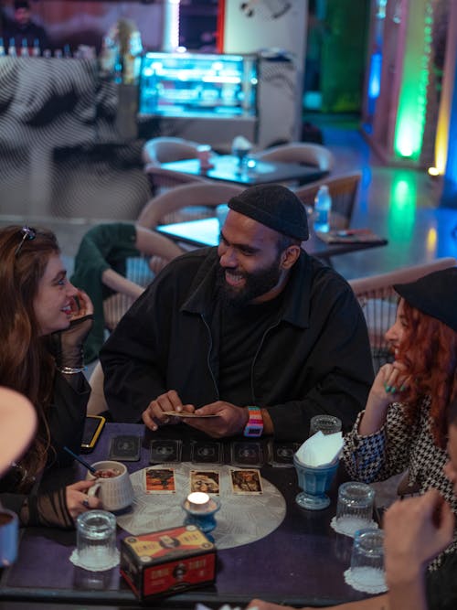 Friends Playing Cards in a Bar