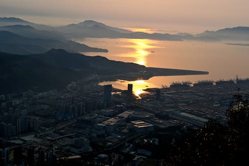 Aerial View of a Coastal City at Sunset