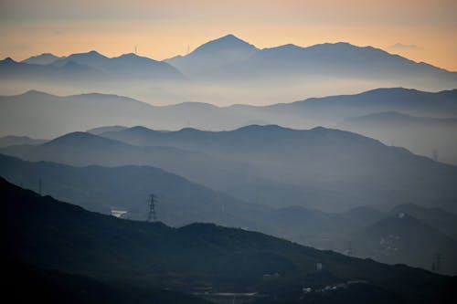 Landscape of Foggy Mountains at Dawn