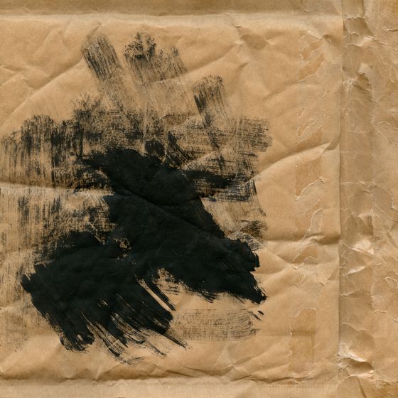 Black ink brushstroke on kraft paper, photo by Heather Green on Pexels