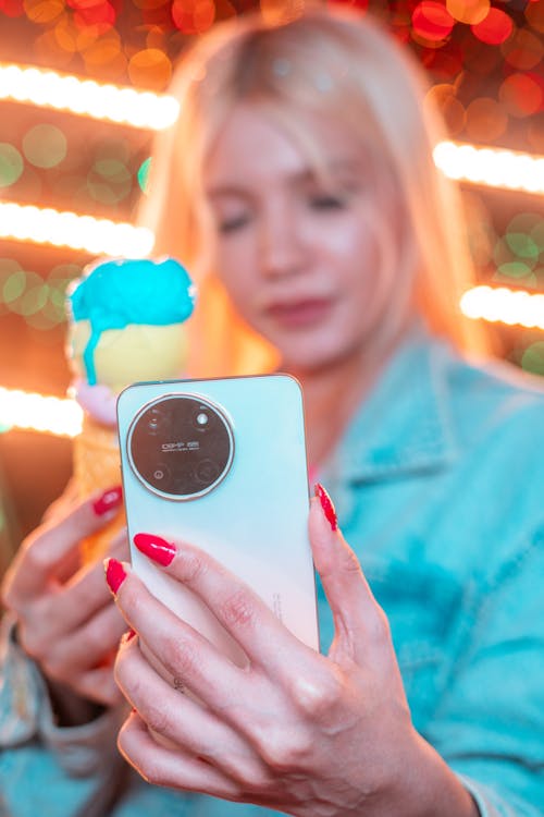 Blonde Woman Taking a Selfie with a Smart Phone