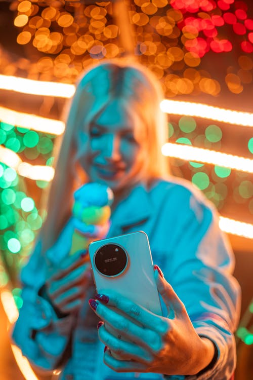 Woman with an Ice Cream Cone Taking a Selfie