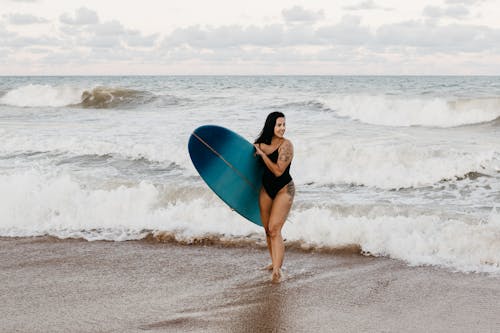 A Woman with a Surfboard