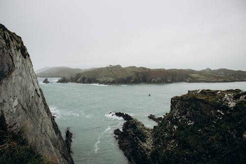 Sea and a Cliff with a Distant Island