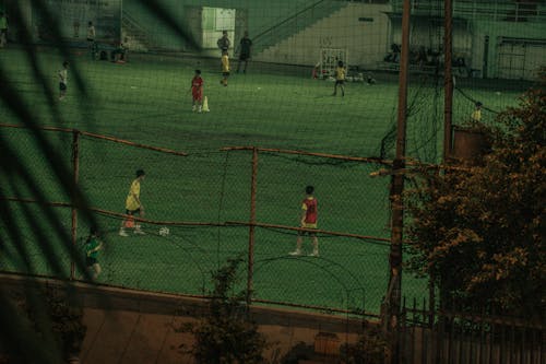 Boys Playing Soccer on a Field 