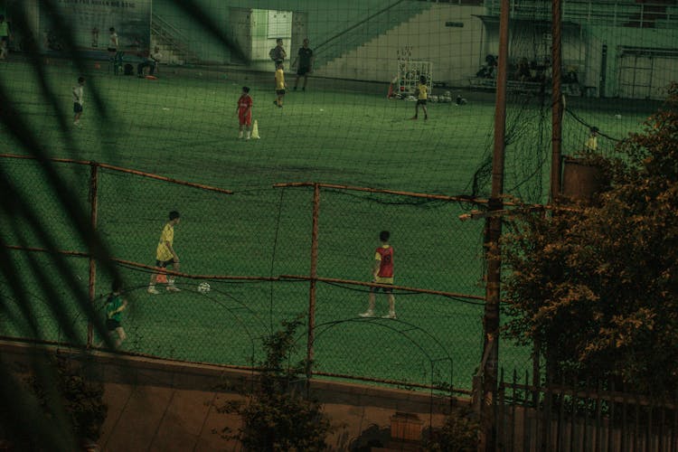 Boys Playing Soccer On A Field 