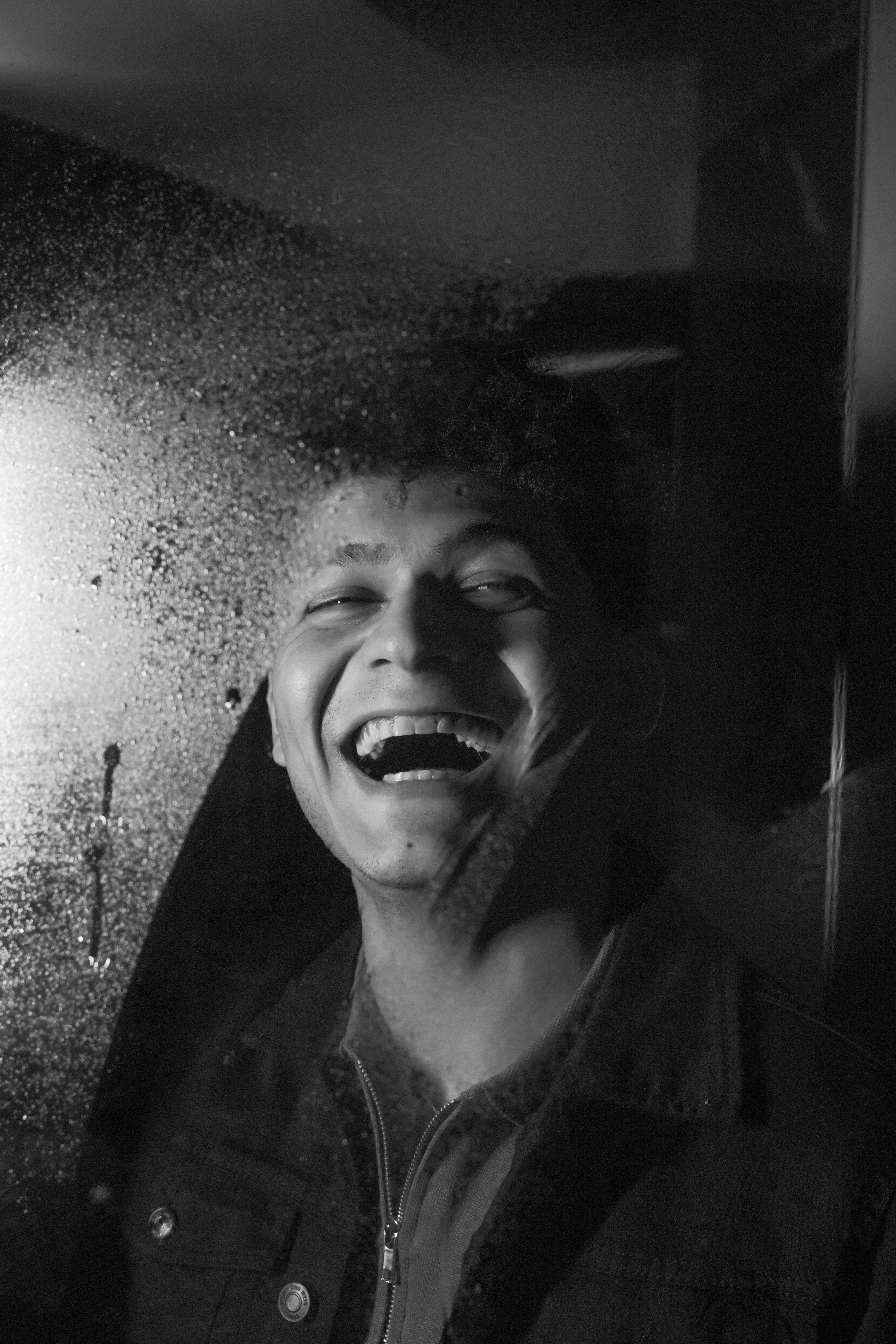 Laughing Man behind Steamy Window · Free Stock Photo