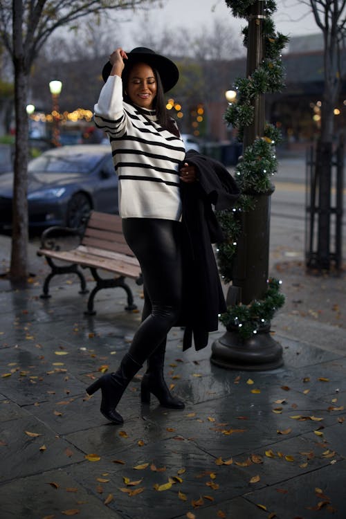 Woman Wearing Sweater on City Street