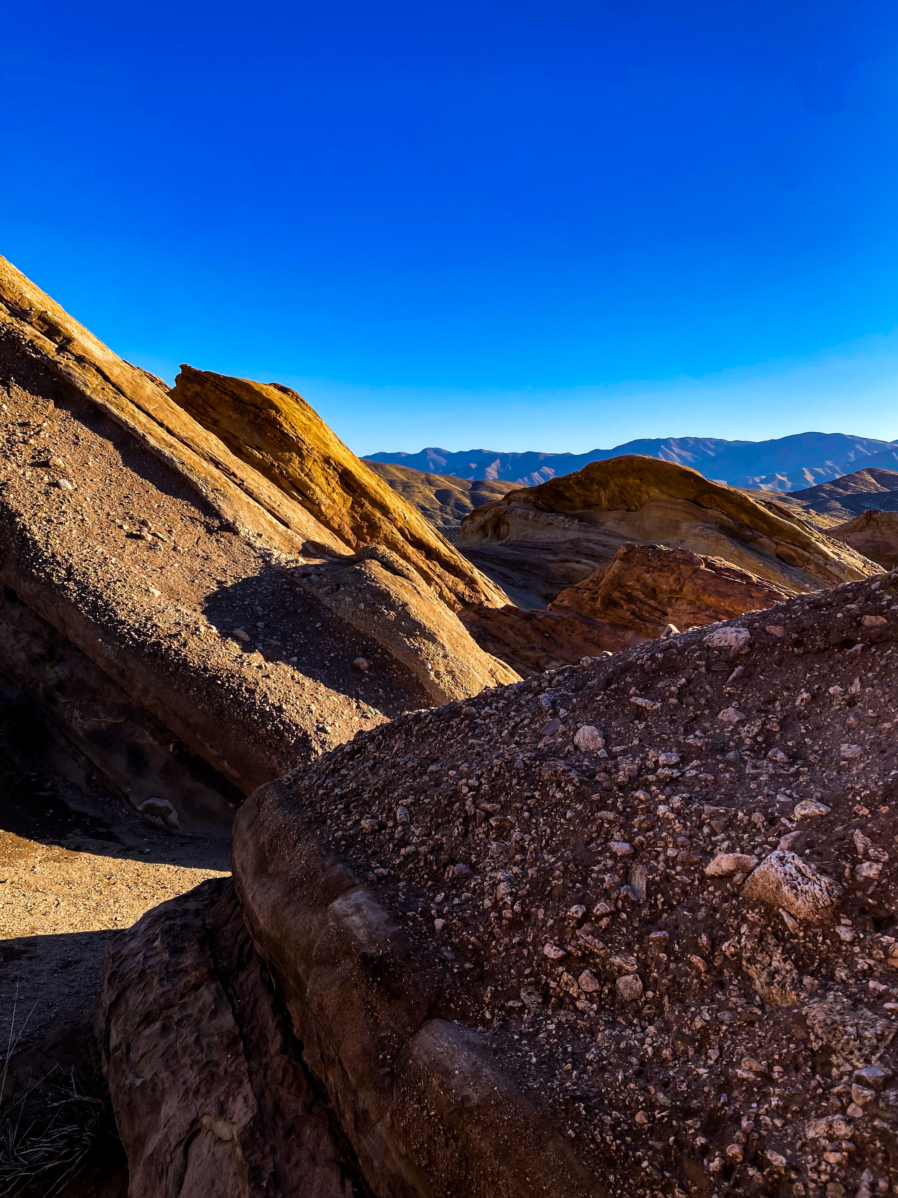 Rough Terrain of Eroded Rocks under Clear Sky · Free Stock Photo