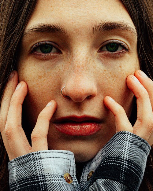 Cinematic shot of a woman with green eyes and freckles