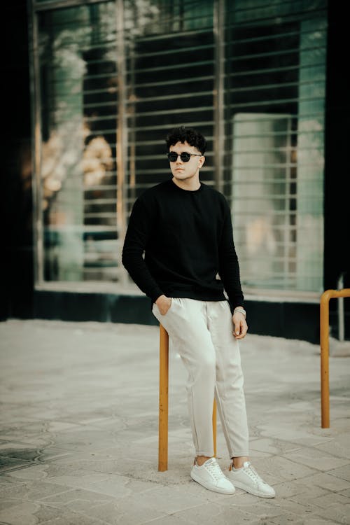 Man Wearing Black Sweater on a Street 