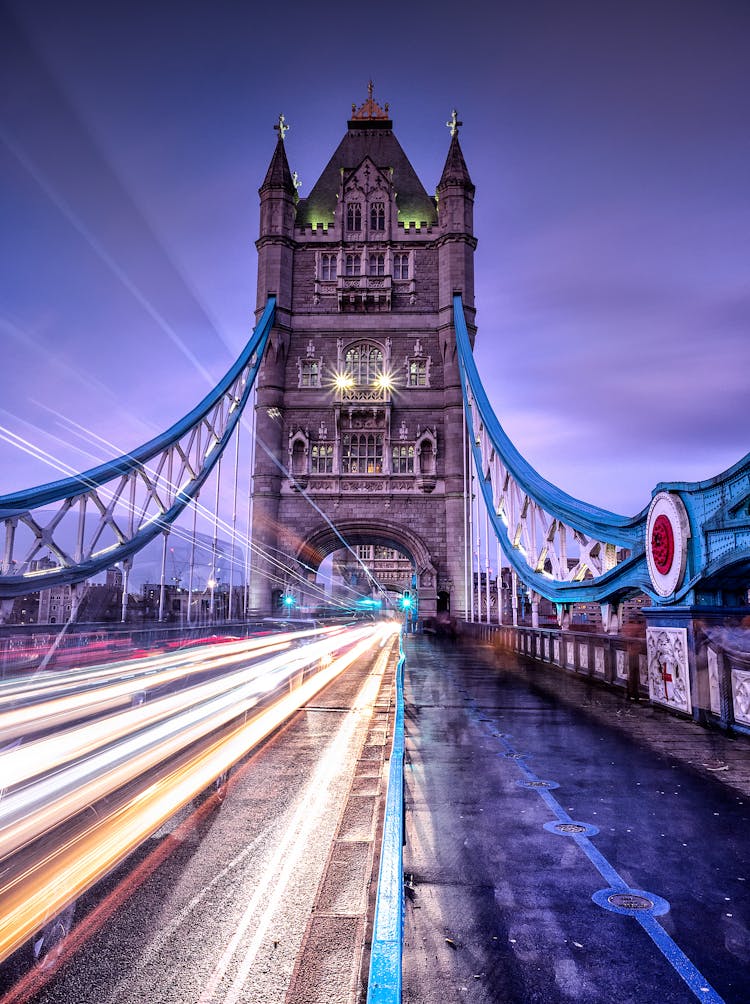 Long Exposure Of Cars On The Tower Bridge In London, England, UK 