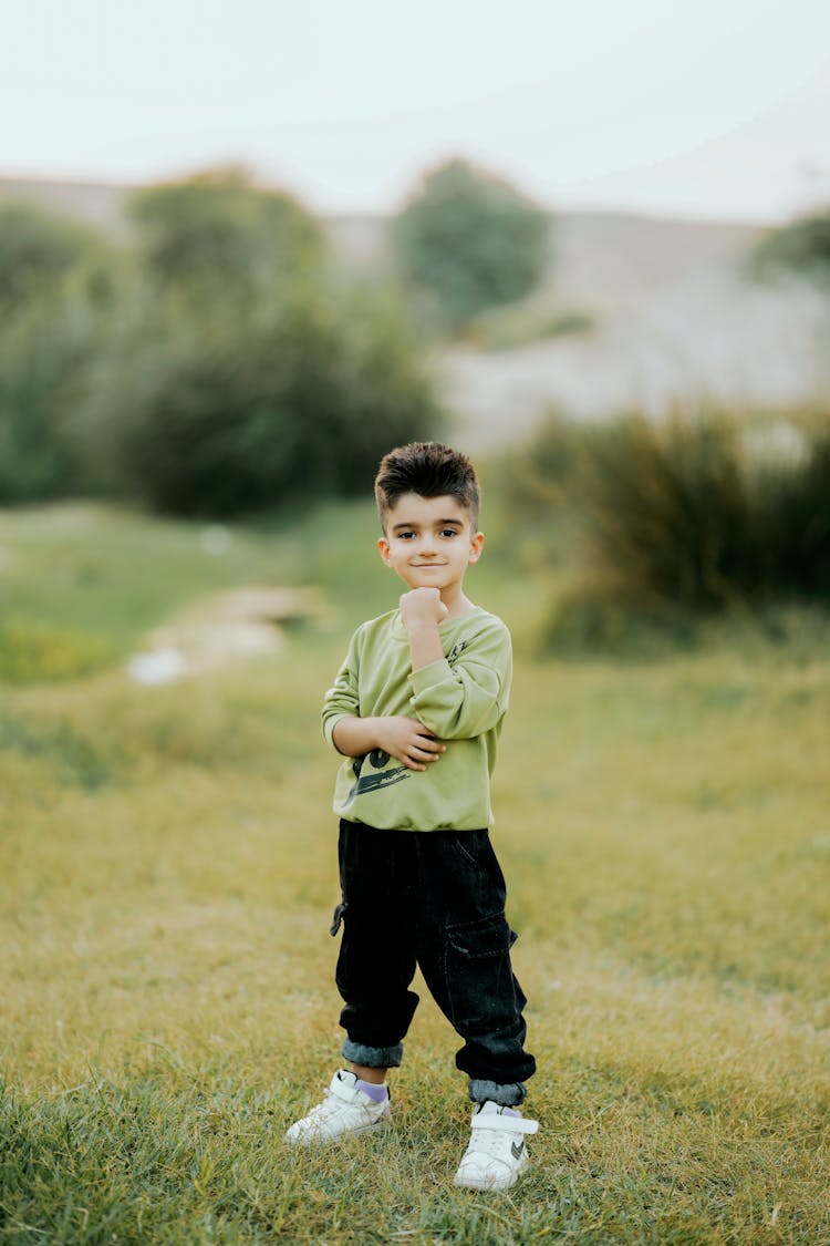 Little Boy On A Field