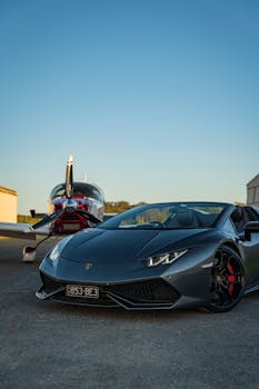 Luxury Lamborghini Huracan and private plane at Gold Coast Airport, QLD, Australia.