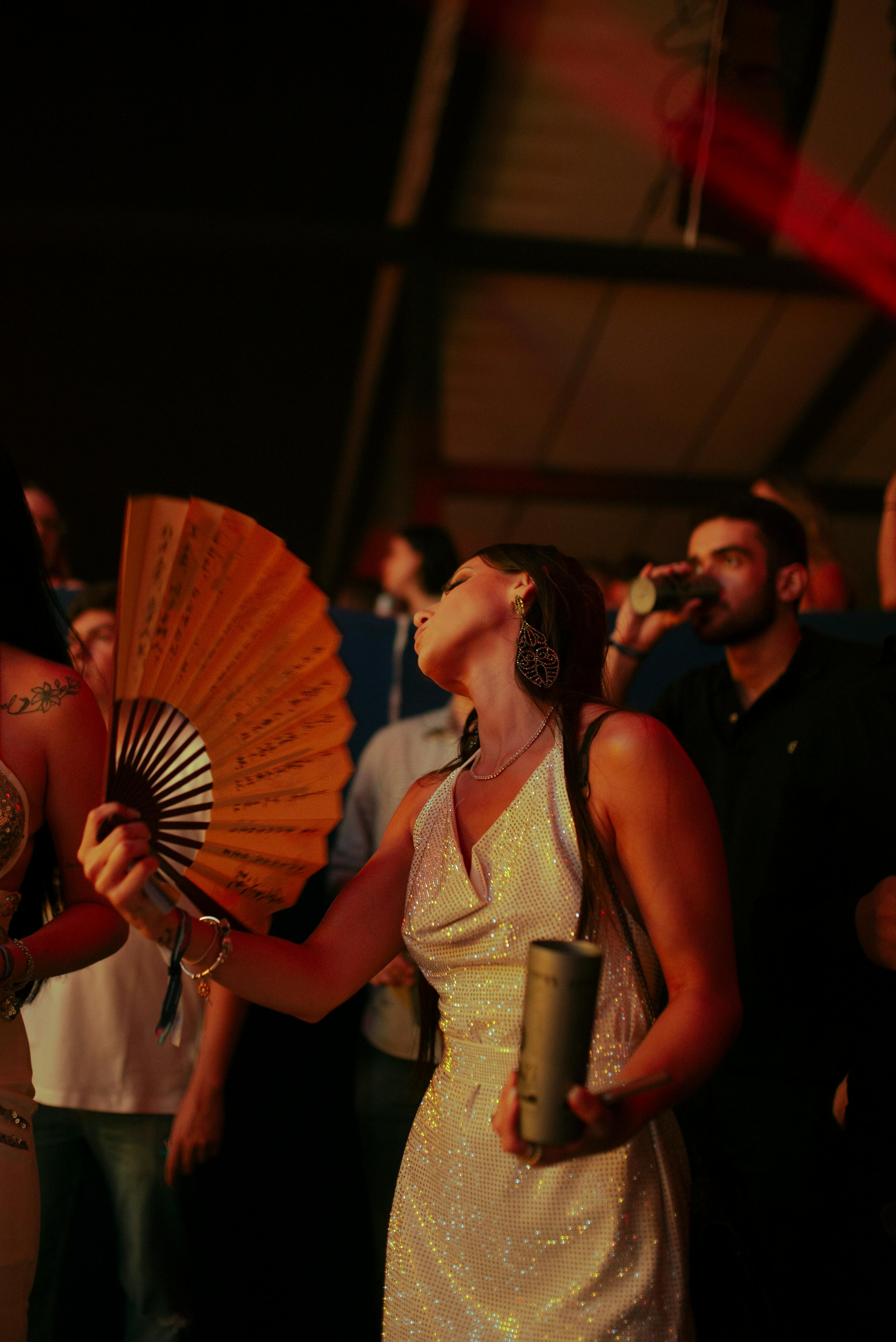 woman dancing with a fan