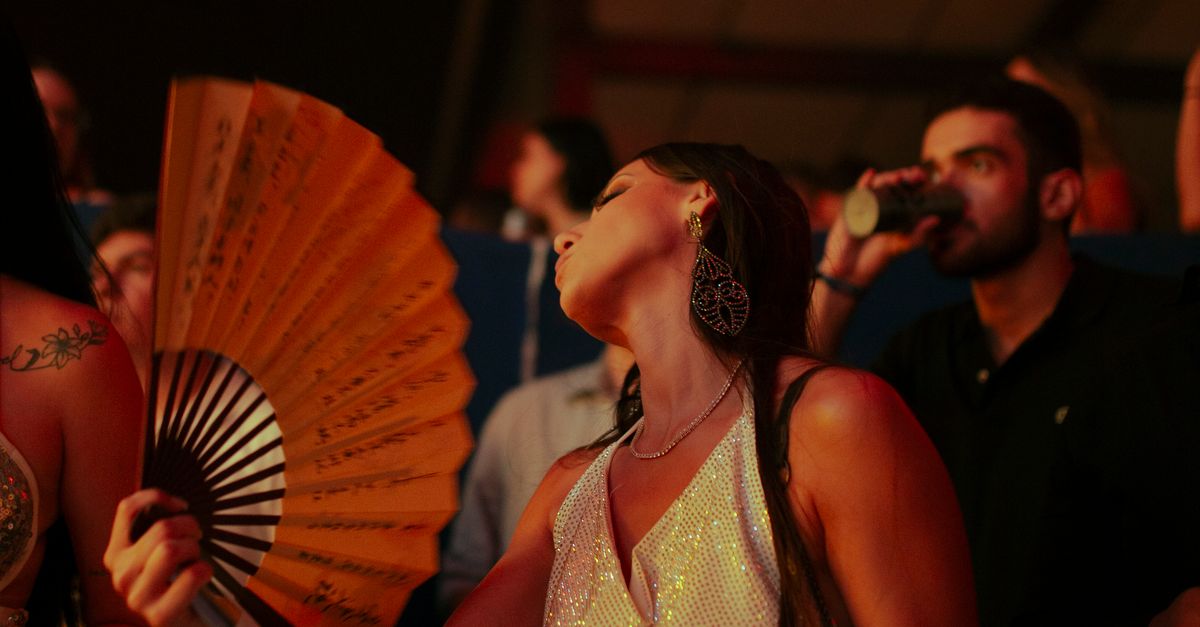 Silly Dance Using Fans Woman Dancing with a Fan ยท Free Stock Photo