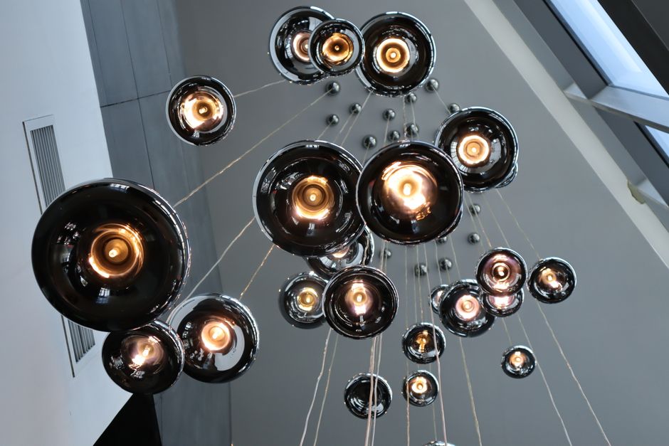 Clustered pendant chandelier in double height penthouse Clustered pendant chandelier in double height penthouse