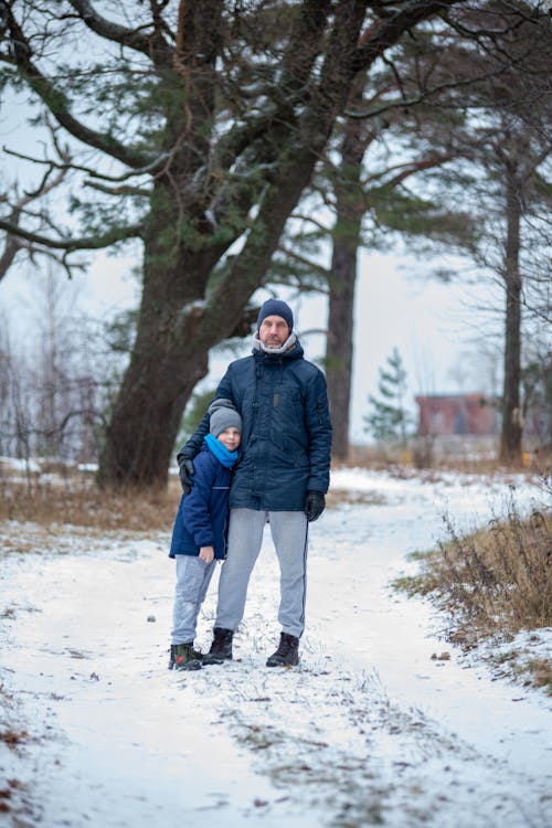 Man with a Son on a Path in Winter 