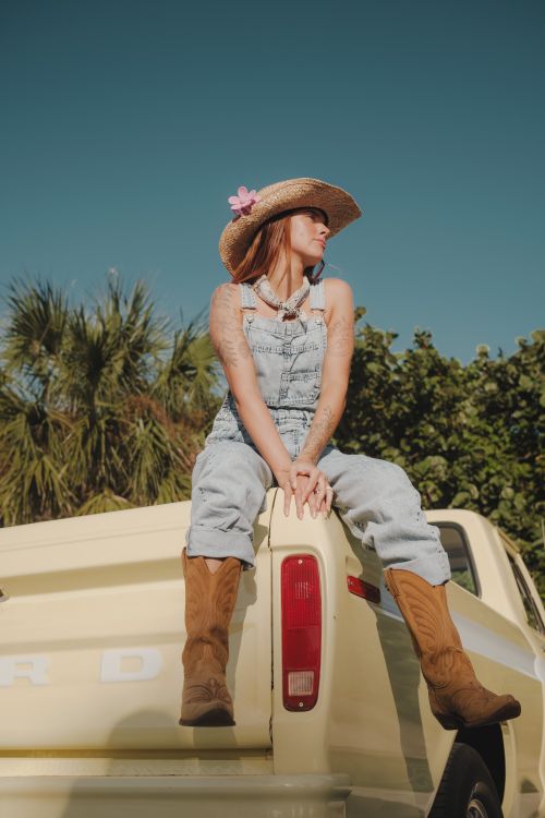 Woman Wearing Cowboy Outfit Sitting on a Track Free Stock Photo Woman Wearing Cowboy Outfit Sitting on a Track Free Stock Photo