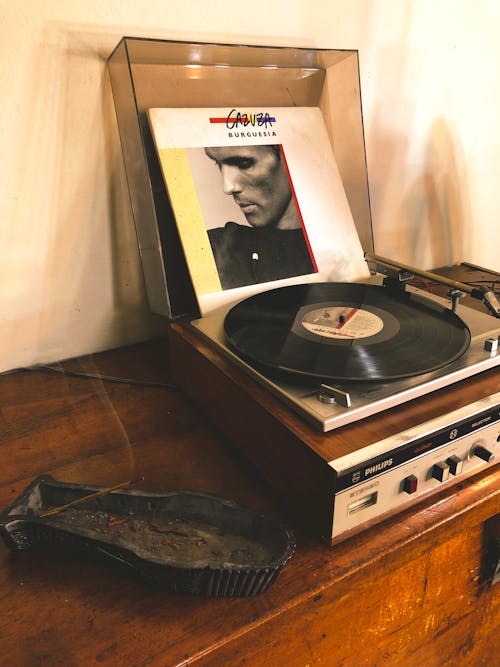Free Vinyl Record in Vinyl Player on Table Stock Photo