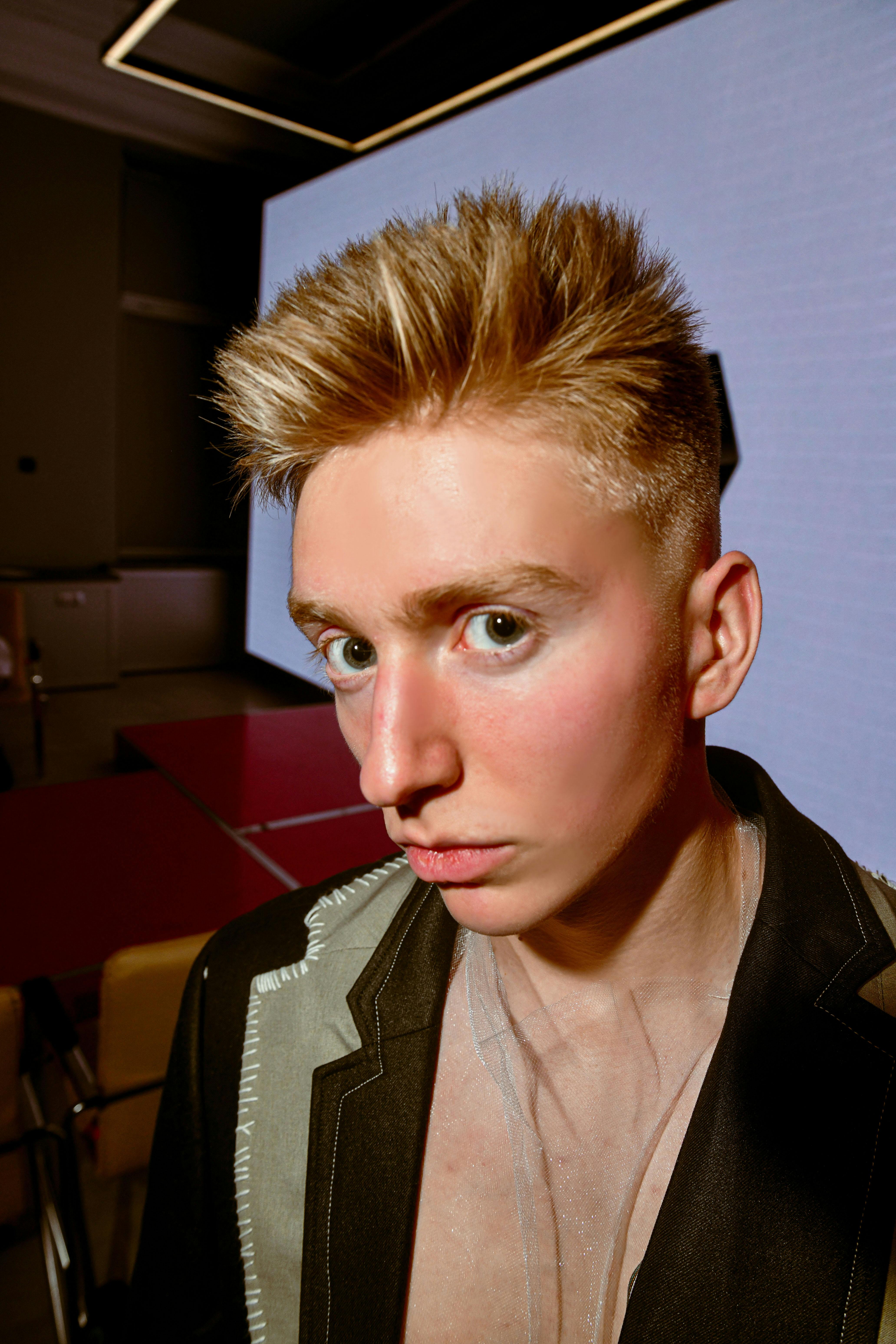 Young Blonde Man Posing in a White Top · Free Stock Photo