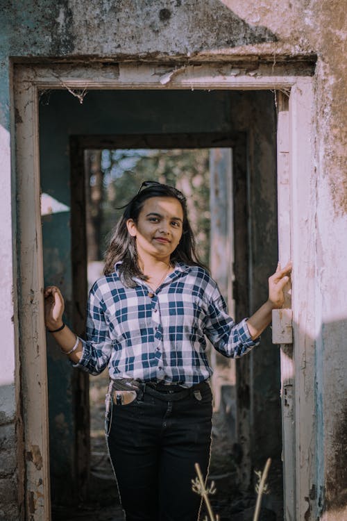 Woman in Shirt Standing in Doorway