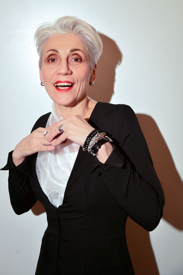 Studio portrait of a senior woman in a blazer — photo by Konstantin Mishchenko on Pexels