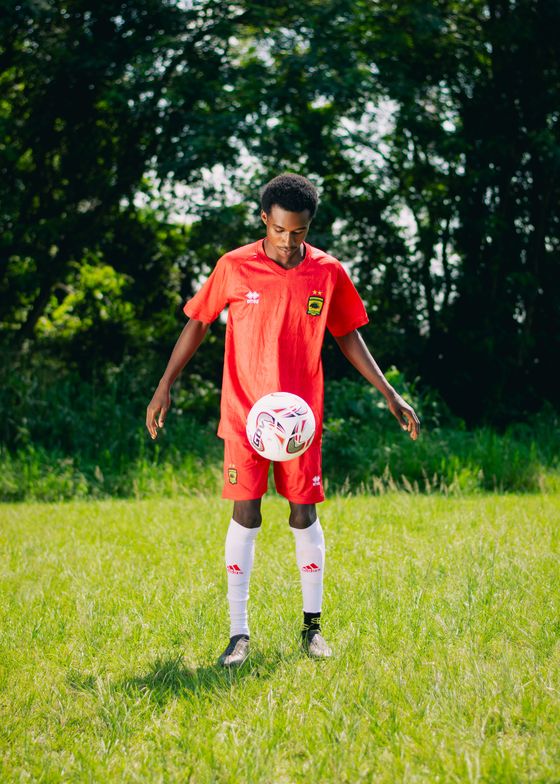 Player in the new red shirt juggling a ball — photo by Bigshow Lamar Campton on Pexels