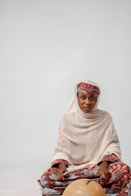 Studio Shot of a Young Woman Wearing Traditional Clothing 