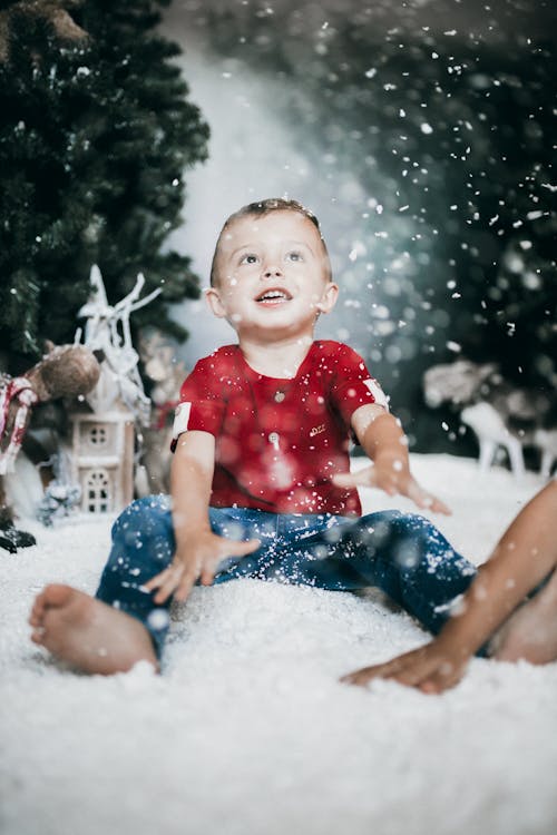 A Boy Sitting on the Ground