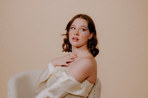 Brunette Woman Posing in White Dress 