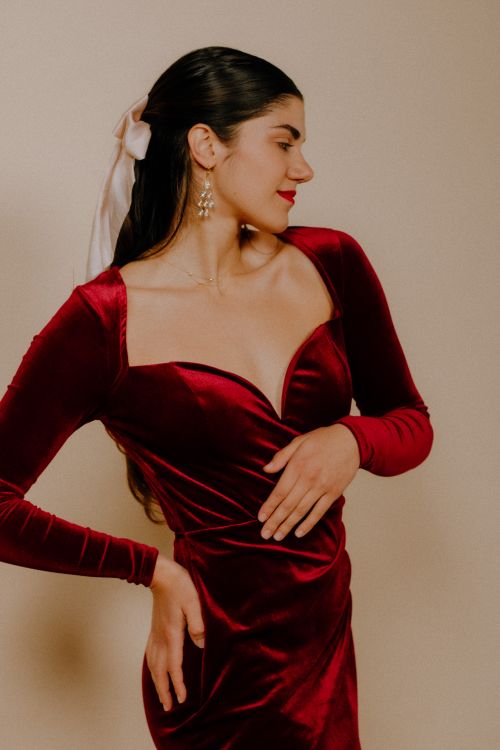 Elegant velvet midi dress wedding guest outfit idea in a rich fall colour