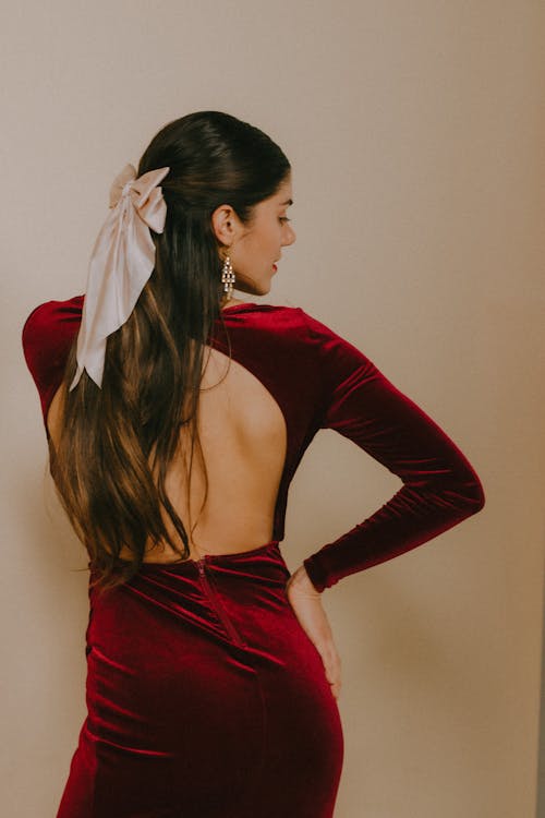 Woman Posing in Burgundy Dress
