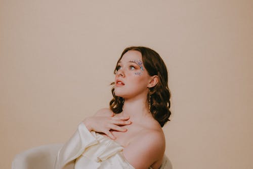 Brunette Woman Posing in White Dress 