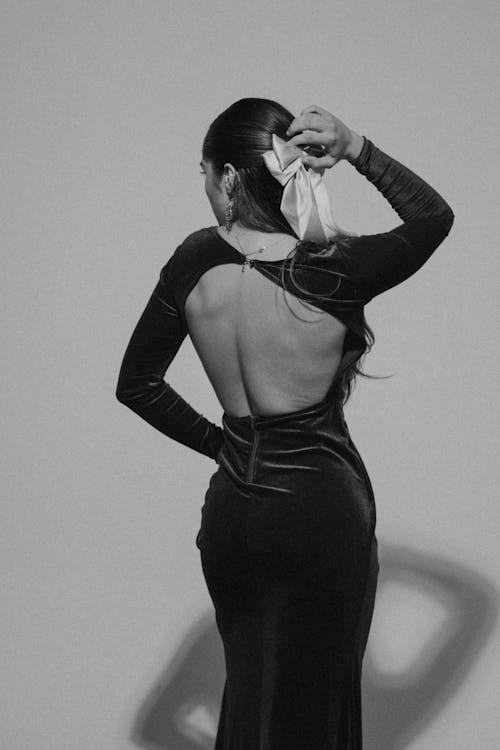 Woman Posing in Elegant Dress in Black and White 