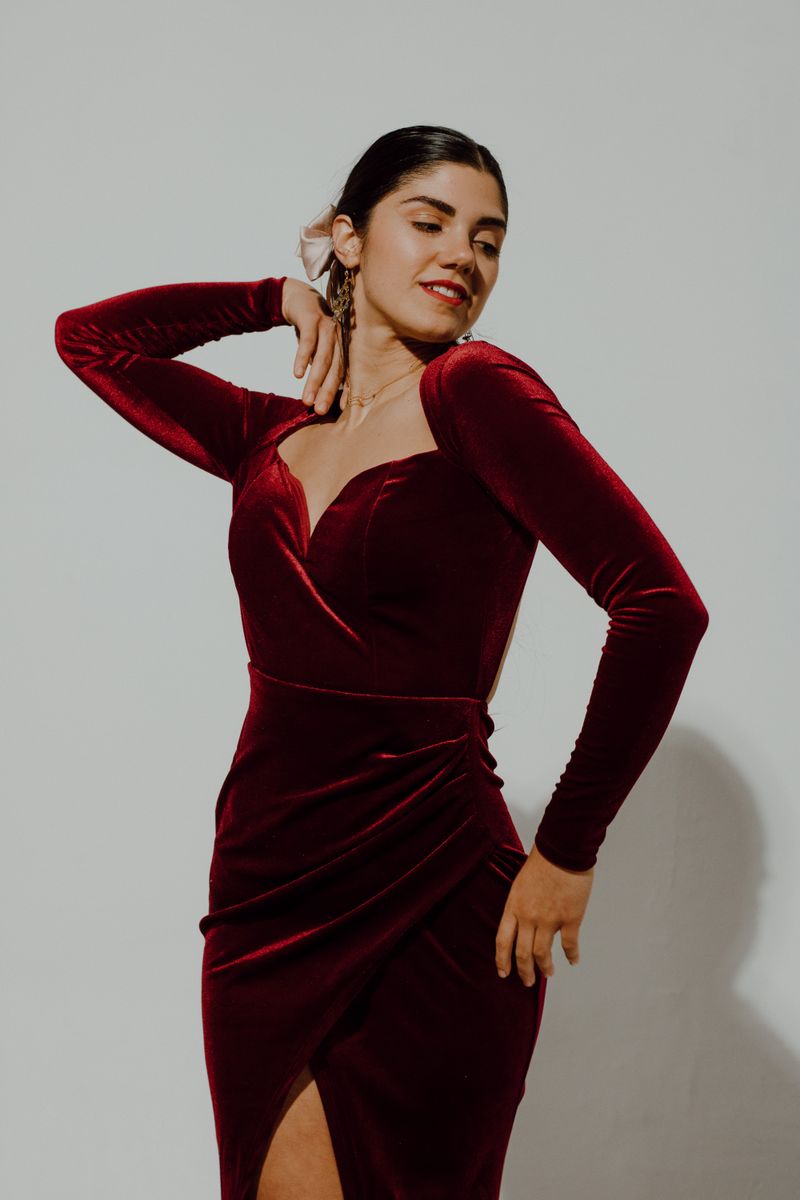 woman in wine-colored crepe wrap dress