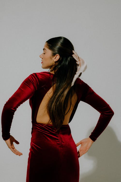 Brunette in Elegant Red Dress Posing in Studio