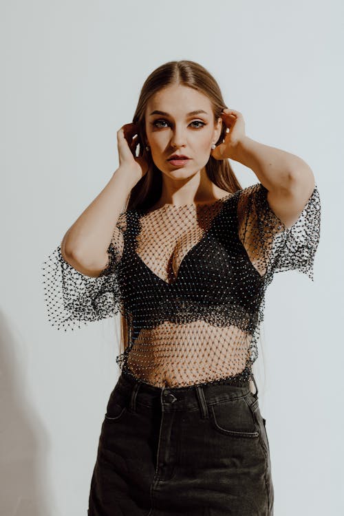 Glamour Looking Woman wearing Mesh Blouse