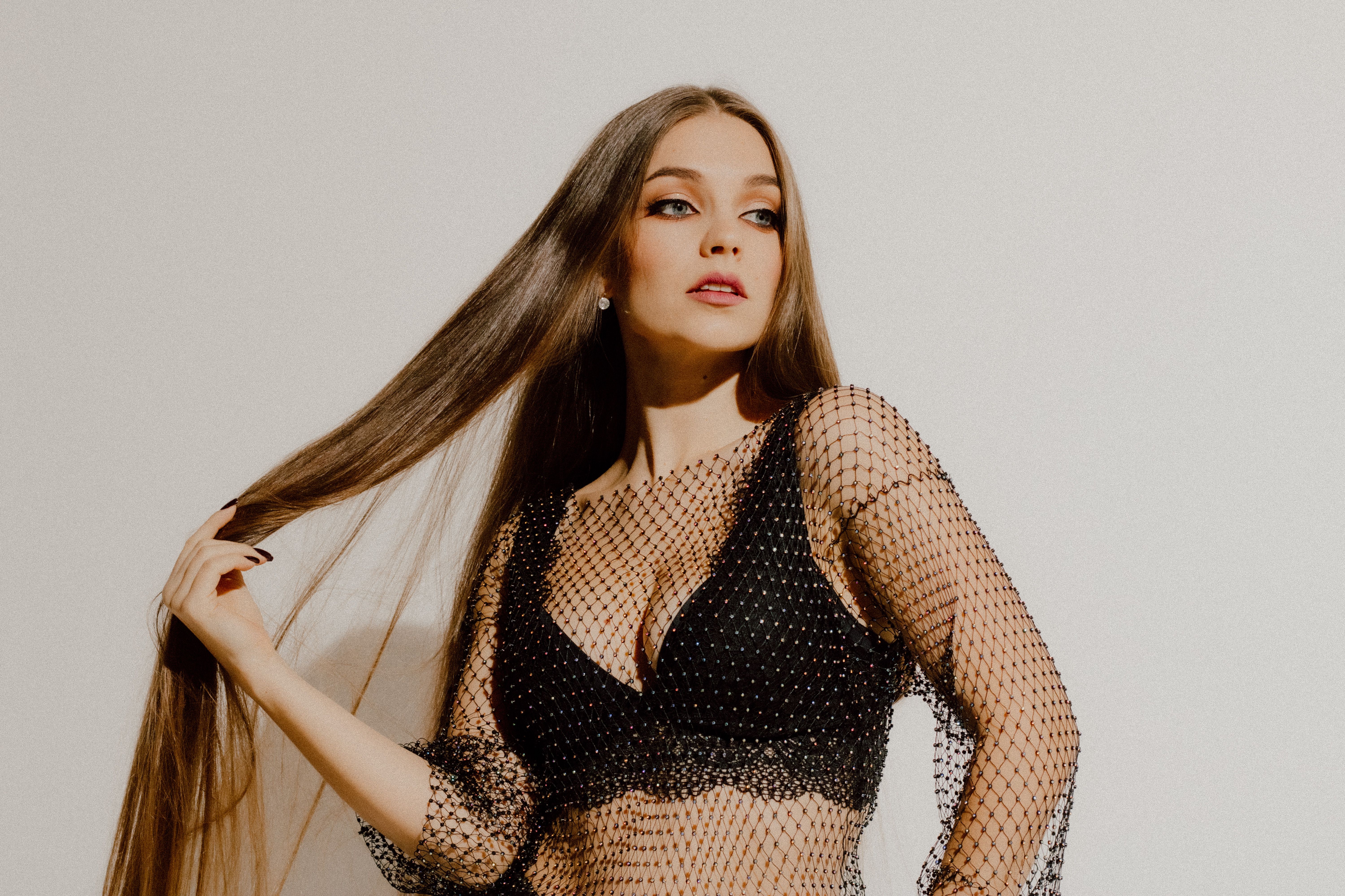 Sexy Young Woman in Mesh Top and Lingerie in Studio · Free Stock Photo