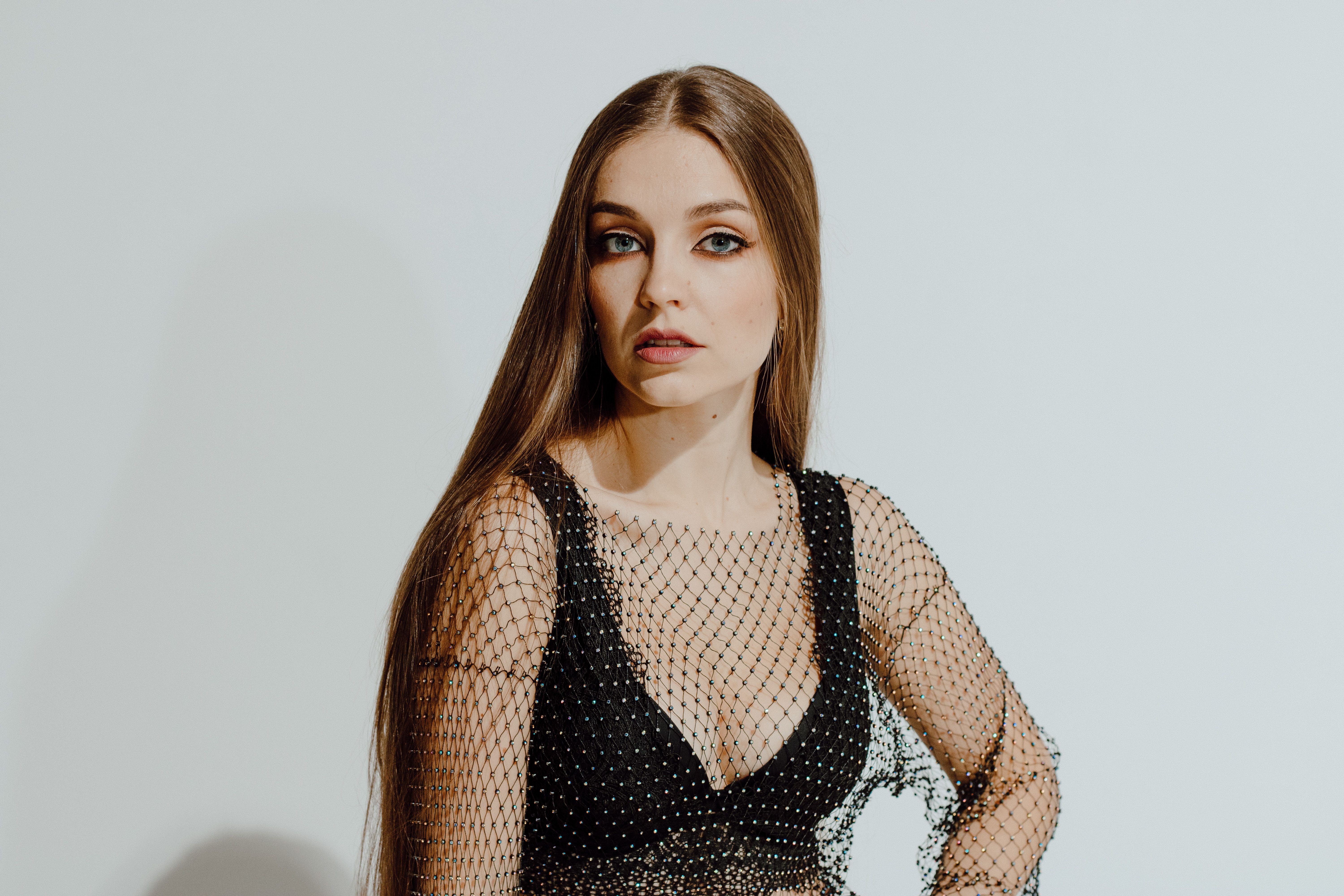 Young Woman in Mesh Top and Lingerie in Studio · Free Stock Photo
