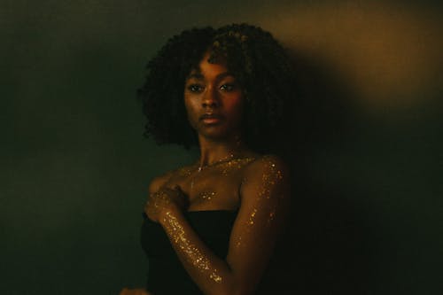 Portrait of Woman with Glitter on Arms