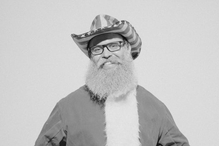 Smiling Man In Santa Claus Costume In Black And White